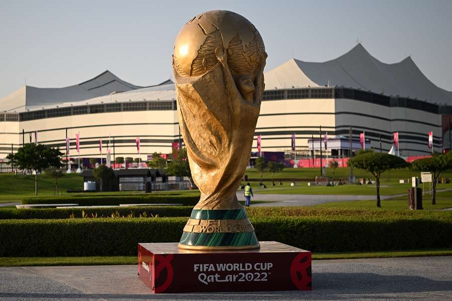 A giant replica of the World Cup trophy stands in front of the Al-Bayt Stadium, where the tournament kicks off 