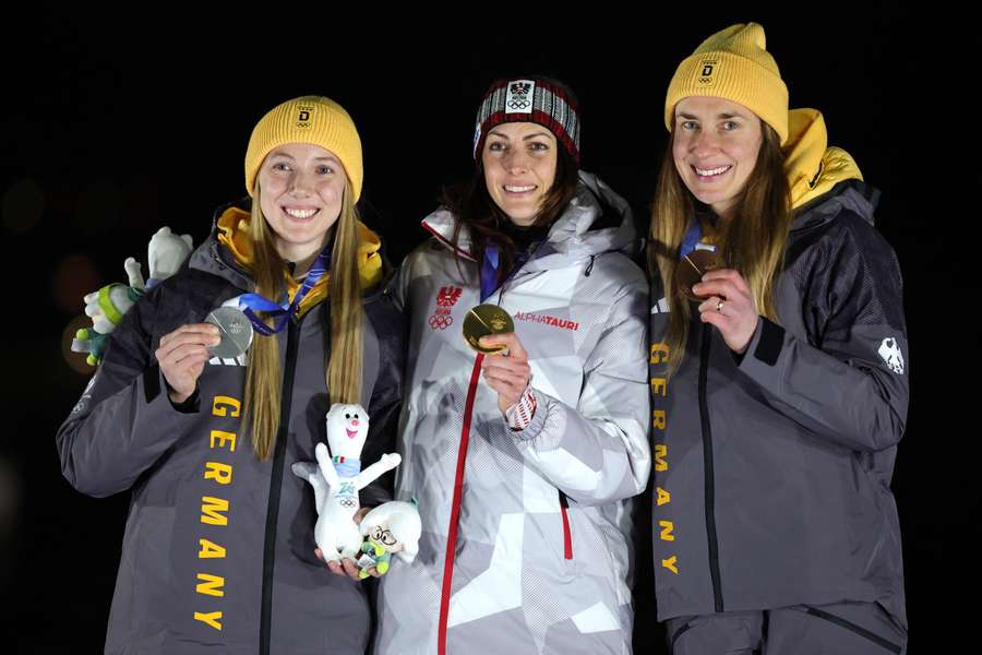 Janine Flock with her gold medal alongside Susanne Kreher, left, and Jacqueline Pfeifer
