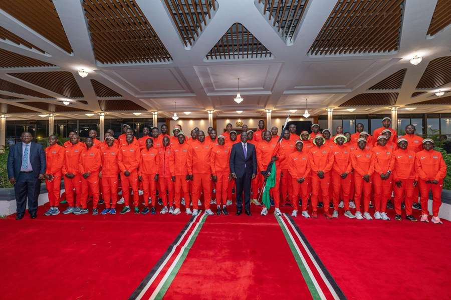 Team Kenya pose for a photo with President Ruto before departing for Tokyo
