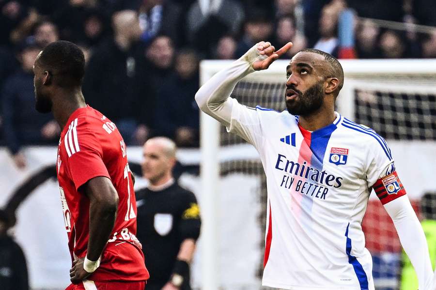Lyon's French forward Alexandre Lacazette celebrates after scoring against Brest
