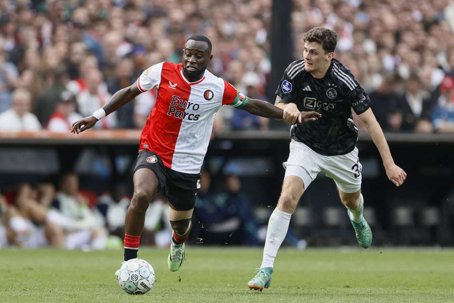 Feyenoord's Lutsharel Geertruida (left) and Ajax's Benjamin Tahirovic fight for the ball