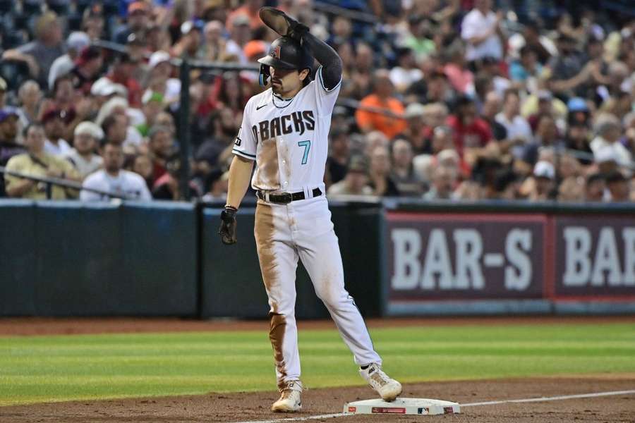 Corbin Carroll celebrates after his 50th stolen base of the season in the third inning against the San Francisco Giants at Chase Field