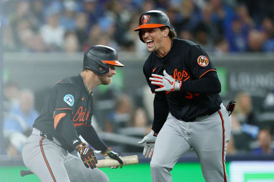 Baltimore Orioles catcher Adley Rutchman (right) and Jordan Wetsburg (left) celebrating after a home run