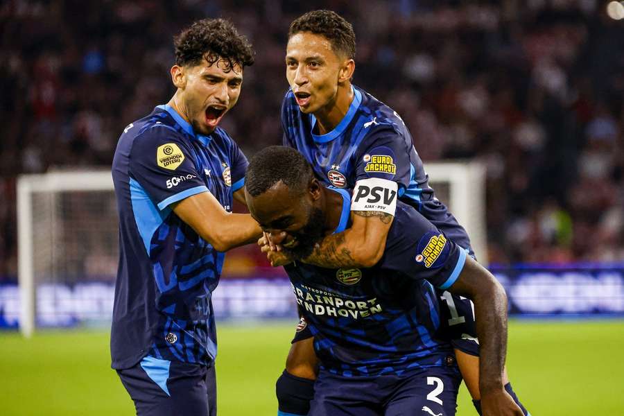PSV celebrate Lutsharel Geertruida's goal against Ajax