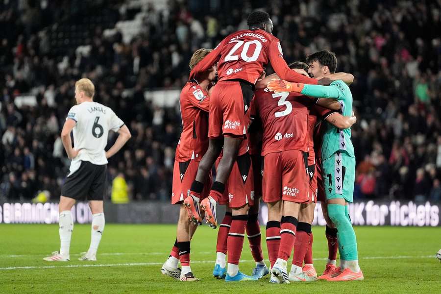 West Brom players celebrate their team win with a huddle West Brom players celebrate their team win with a huddle