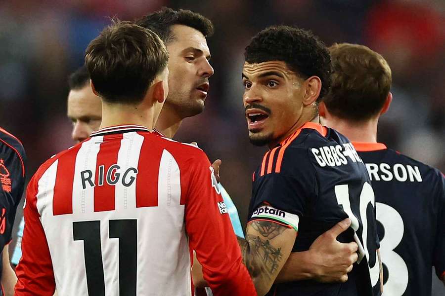 Sunderland's Chris Rigg clashes with Nottingham Forest's Morgan Gibbs-White as Sunderland's Granit Xhaka intervenes