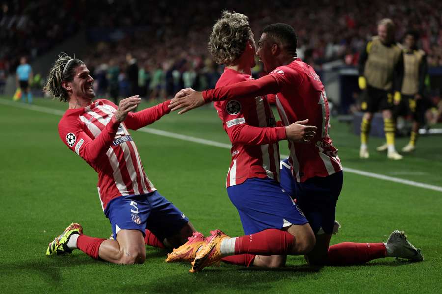 Atletico Madrid's Brazilian forward Samuel Lino celebrates with teammates after scoring his team's second goal