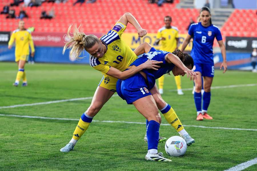 Sweden's Fridolina Rolfo and Serbia's Vesna Milivojevic battle for the ball
