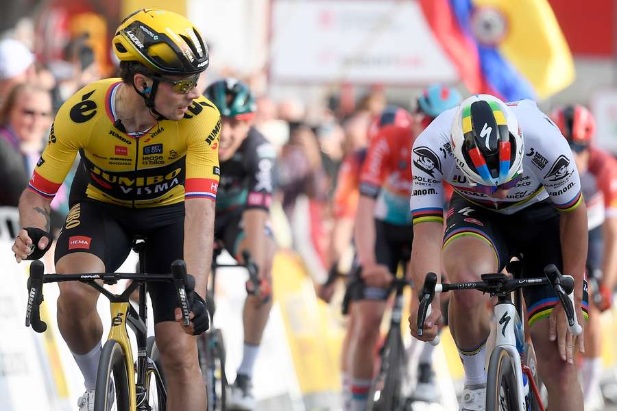 Team Jumbo's Slovenian rider Primoz Roglic (L) crosses the finish line first ahead of Quick-Step Belgian rider Remco Evenepoel