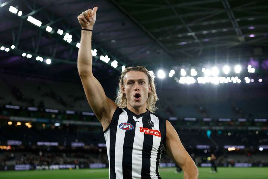 Collingwood captain Darcy Moore celebrates their crucial win over GWS Giants. 