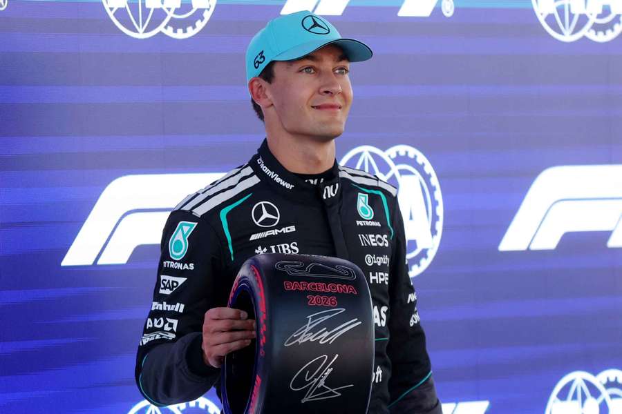 George Russell celebrates after qualifying in pole position