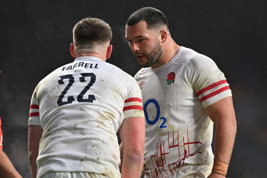 Owen Farrell and Ellis Genge react to a France try