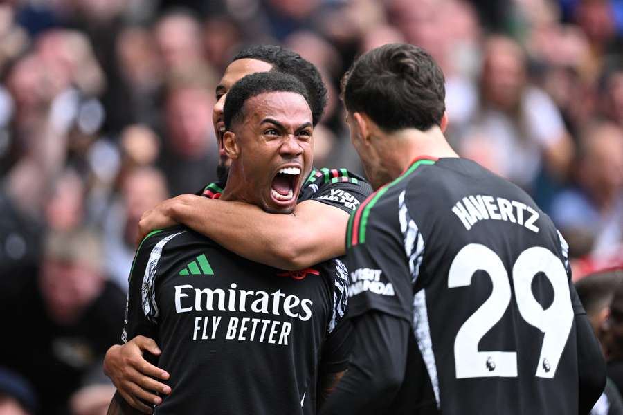 Gabriel celebrates giving Arsenal the lead over Tottenham