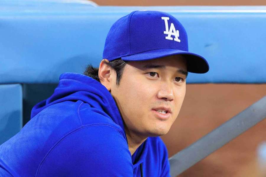 Shohei Ohtani watches on from the dugout