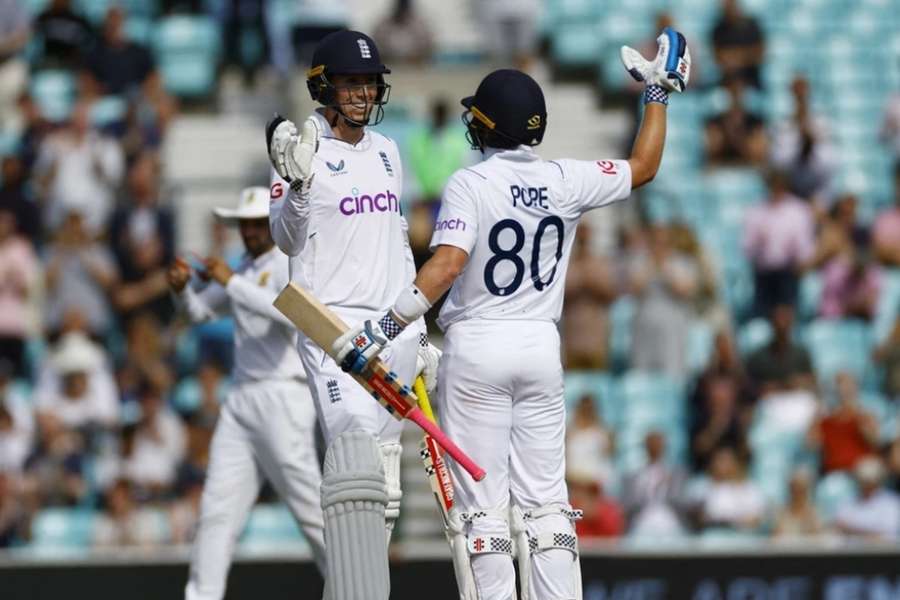 Crawley (L) and Pope celebrate England's Test win