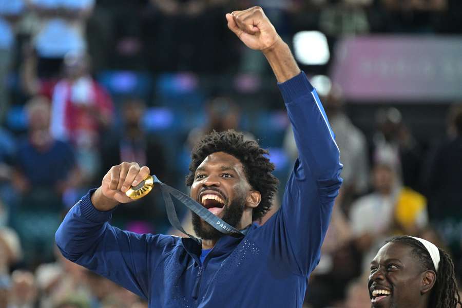 Joel Embiid celebrates winning Olympic gold in the basketball with the USA