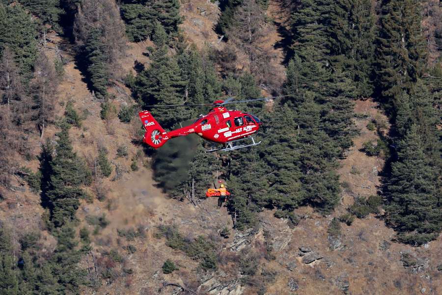 France's Cyprien Sarrazin is transported to a hospital by helicopter