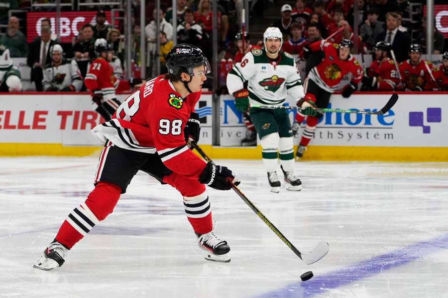 Chicago Blackhawks center Connor Bedard brings the puck up the ice against the Minnesota Wild during the second period at United Center