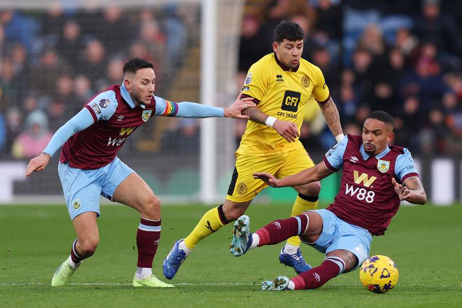 Sheffield United's Gustavo Hamer battles for possession with Burnley's Josh Brownhill and Vitinho