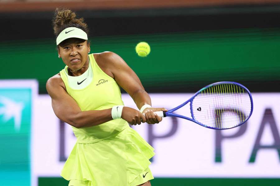 Naomi Osaka plays a backhand against Camila Osorio