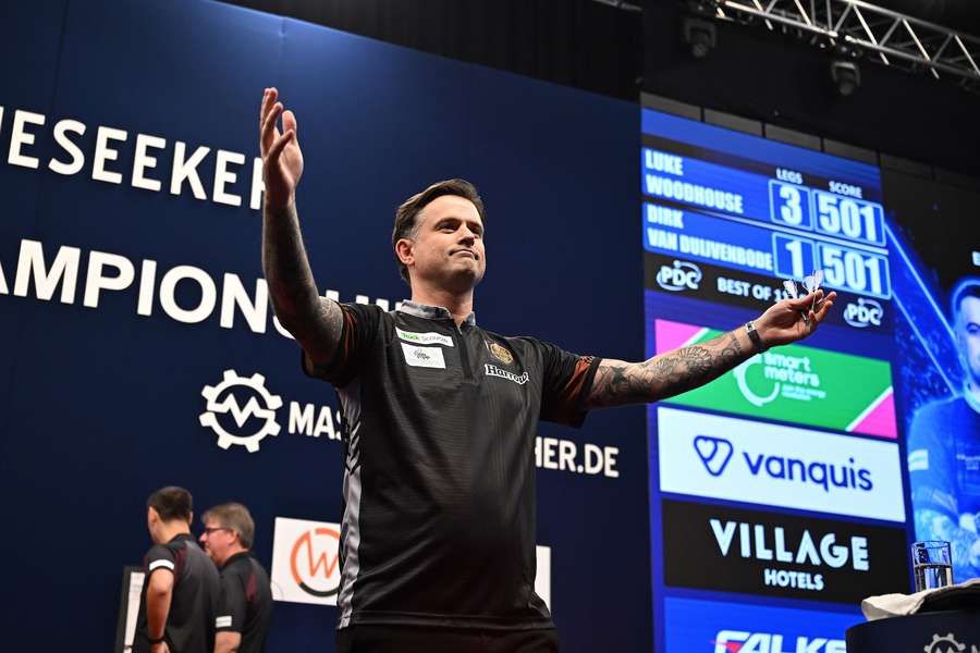 Luke Woodhouse celebrates hitting a nine-darter Luke Woodhouse celebrates hitting a nine-darter