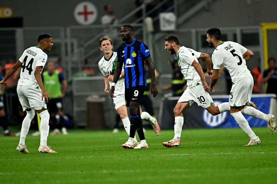 Sassuolo's Italian forward #10 Domenico Berardi (2ndR) celebrates with teammates after scoring next to Inter Milan's French forward #09 Marcus Thuram