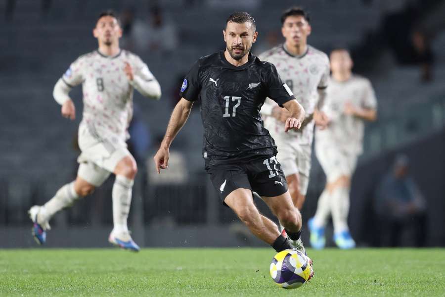 New Zealand's Kosta Barbarouses in action against Chile.