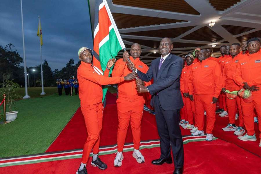 Mary Moraa receives the Kenyan flag from President Ruto before heading to Tokyo