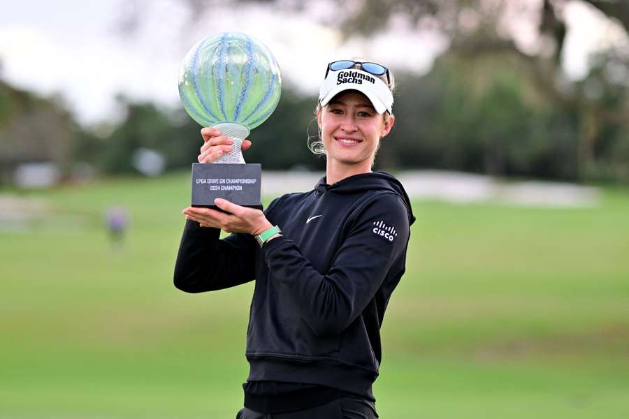 Nelly Korda of the United States poses with the championship trophy after a victory on the second play-off hole