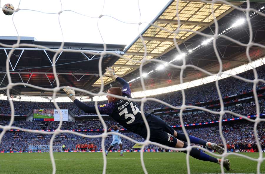 Fankaty Dabo reacts as his penalty against Luton misses the target