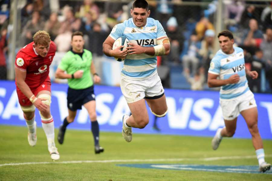 Argentina's Joaquin Oviedo dives to score a try against Wales. Argentina's Joaquin Oviedo dives to score a try against Wales.