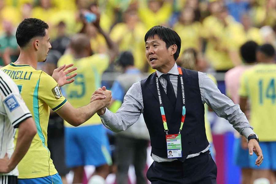 Moriyasu shakes hands with Martinelli at full-time