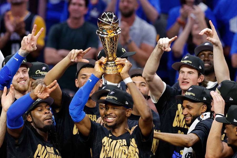 Oklahoma City Thunder's Canadian star Shai Gilgeous-Alexander lifts the Larry O'Brien Championship Trophy Oklahoma City Thunder's Canadian star Shai Gilgeous-Alexander lifts the Larry O'Brien Championship Trophy