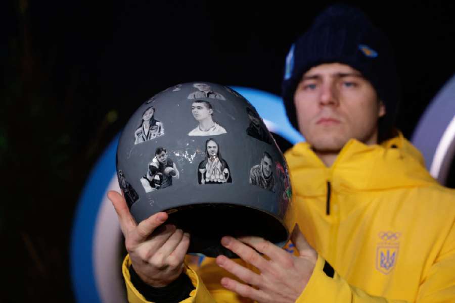 Vladyslav Heraskevych of Ukraine displays his helmet that serves as a tribute to athletes who have died amid Russia's attack on Ukraine