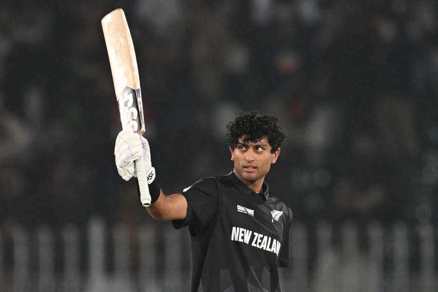 New Zealand’s Rachin Ravindra celebrates after scoring a century