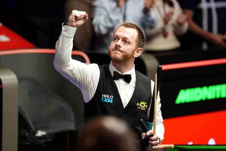 Mark Allen celebrates after his victory