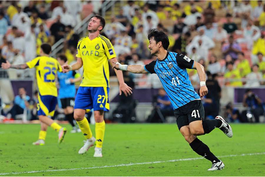 Kawasaki's Akihiro Ienaga celebrates scoring the third goal