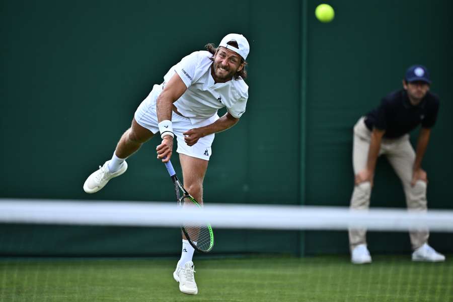 France's Lucas Pouille serves during his first-round match in Wimbledon qualifying