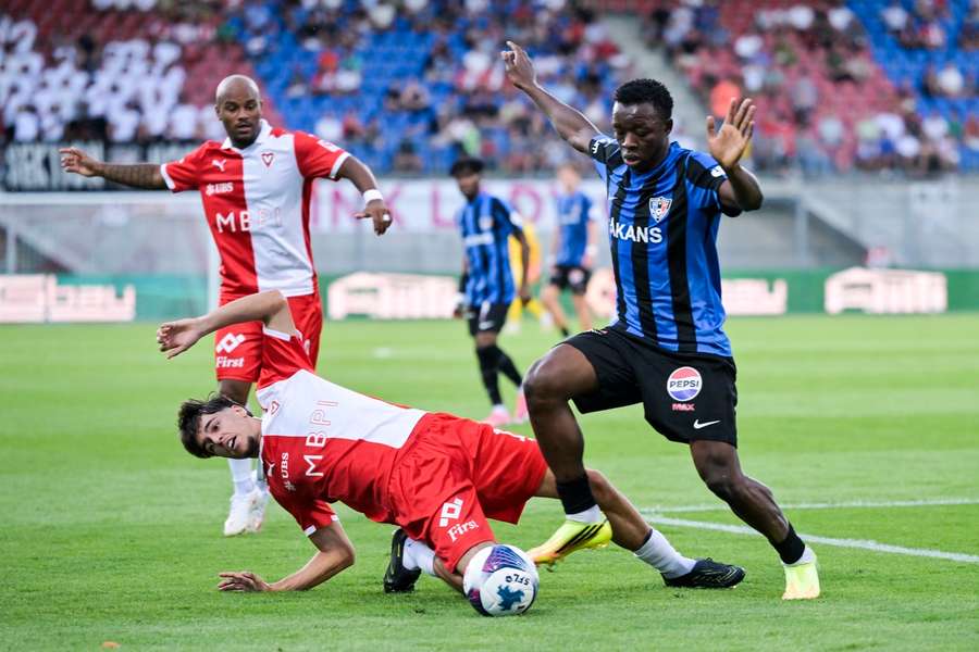 Alie Conteh holds off the challenge of Lutfi Dalipi