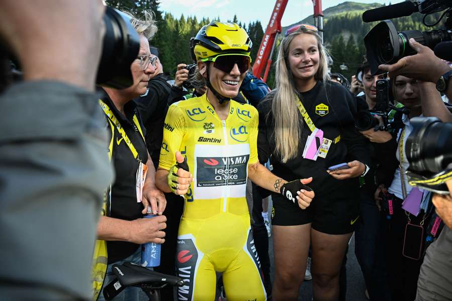 Pauline Ferrand-Prevot celebrates after winning the ninth and final stage