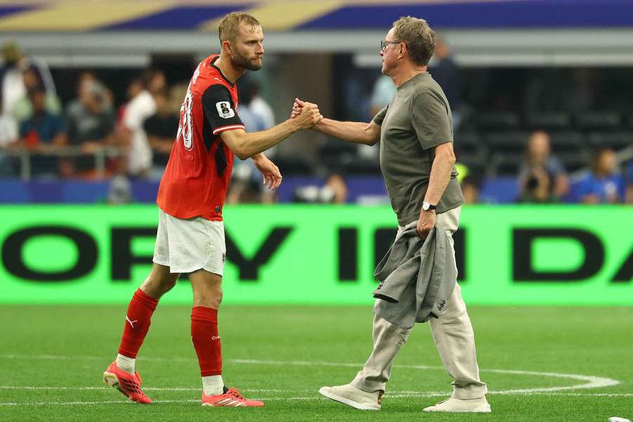 Austria's Konrad Laimer shakes hands with coach Ralf Rangnick after their previous match.