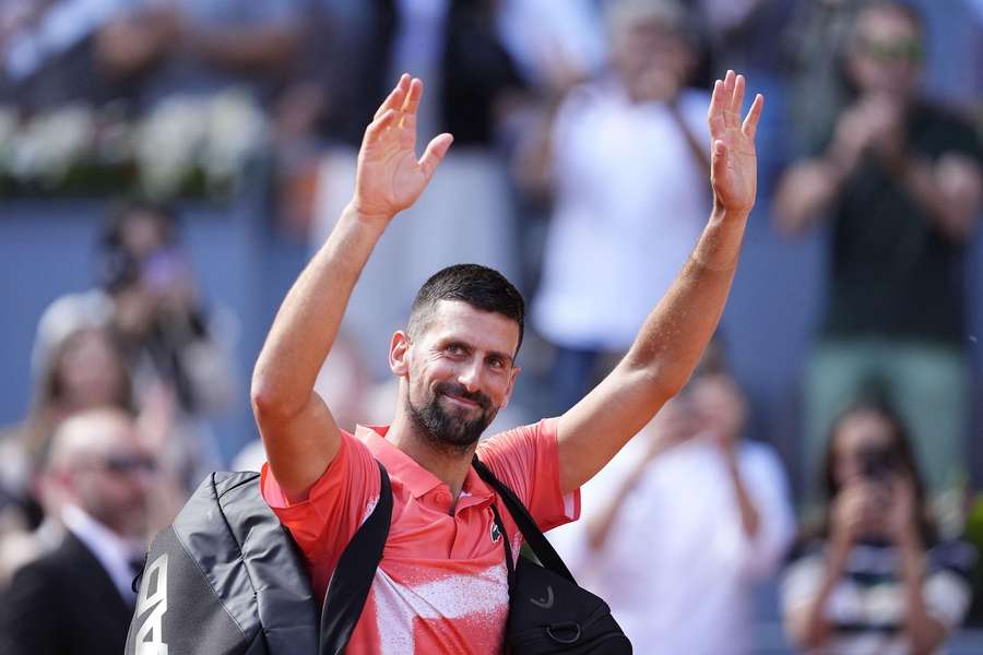 Djokovic waves to the Madrid crowd after his early exit