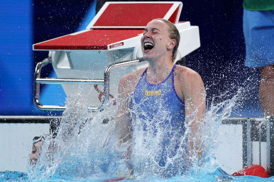 Sarah Sjostrom celebrates after winning the 100m freestyle