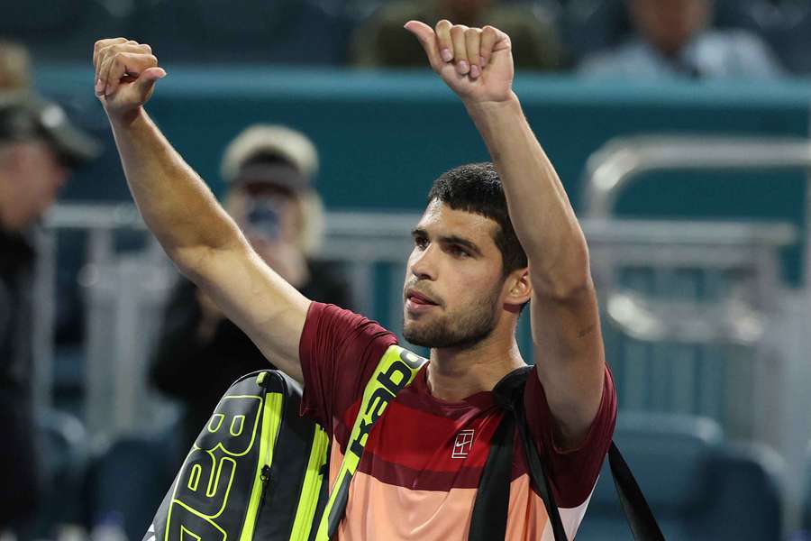 Carlos Alcaraz waves to the crowd after losing his match against David Goffin on Friday