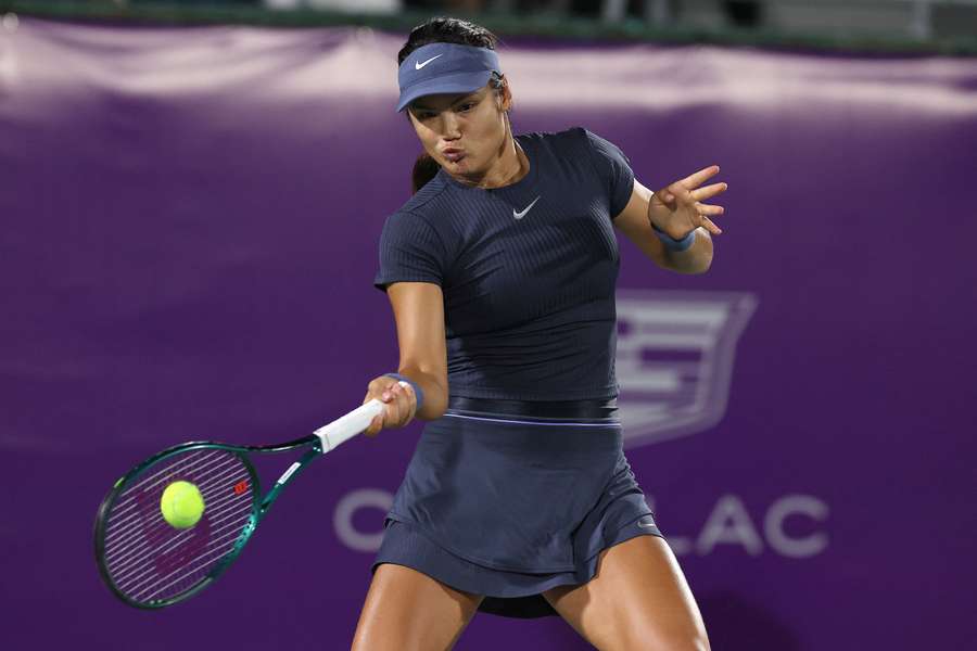 Emma Raducanu returns a shot against Jaqueline Cristian