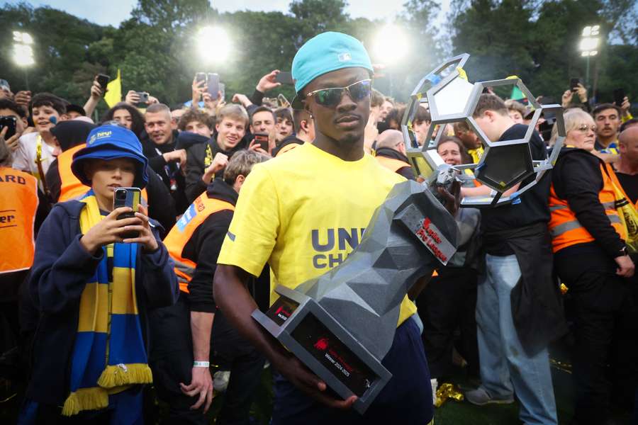 Mohammed Fuseini with the Belgian league trophy during celebrations