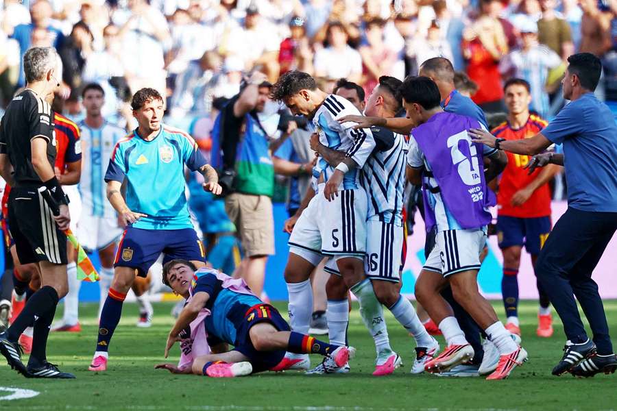 Spain's Gavi clashes with Argentina's Leandro Paredes after the match
