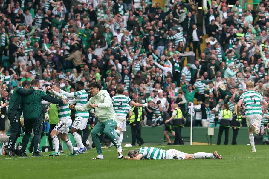 Celtic's players celebrate their last-minute goal against Hearts