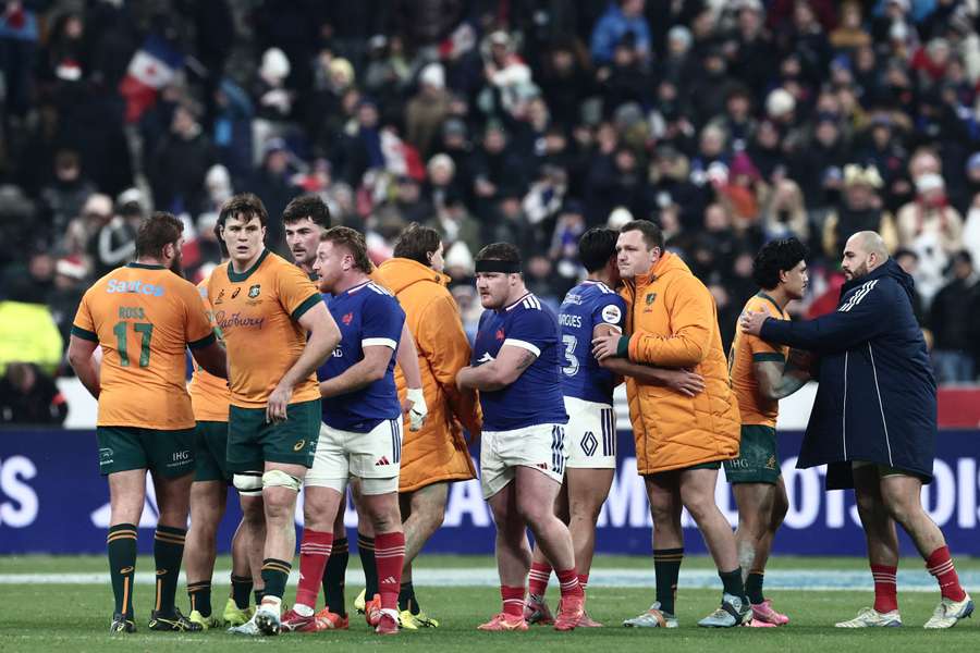 A dejected Wallabies squad shake hands with the French after their weekend loss. A dejected Wallabies squad shake hands with the French after their weekend loss.