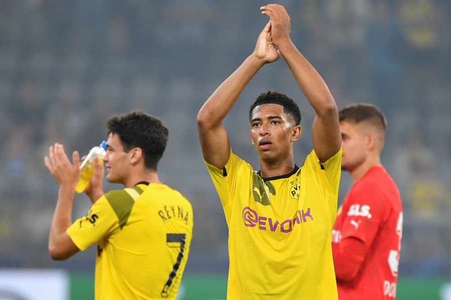 Dortmund's English midfielder Jude Bellingham and US midfielder Giovanni Reyna applaud their fans